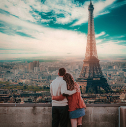 A couple looking at the Eiffel Tower during one of their best dates.
