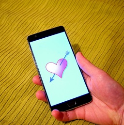 smartphone with heart on screen