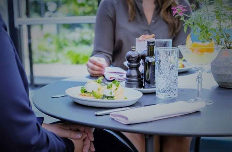 A couple eating together. 