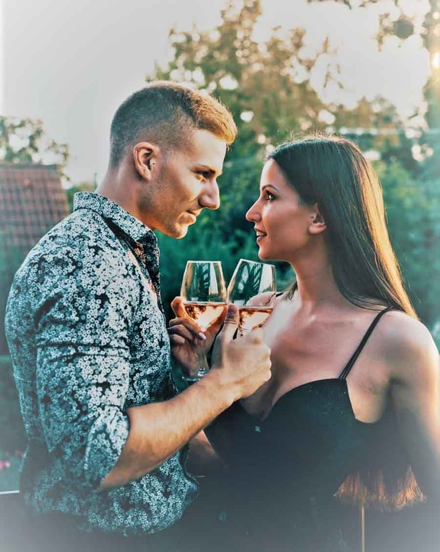 A couple drinking wine.