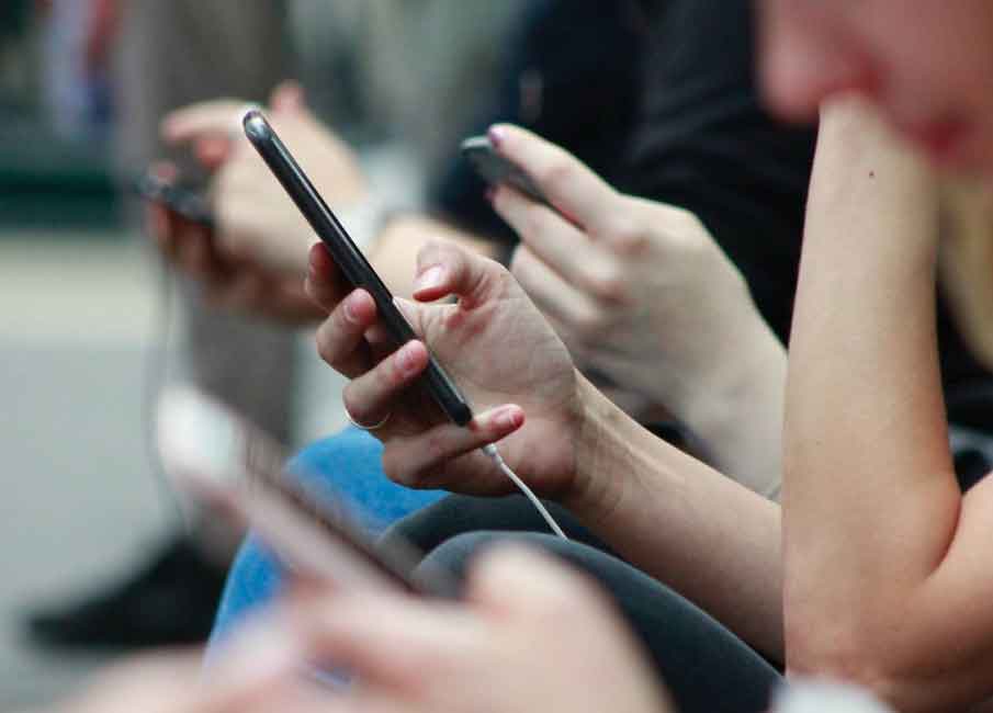 A photo of a people holding their phones