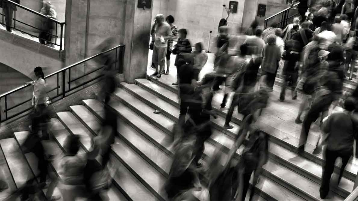 A photo of people walking up and down the stairs