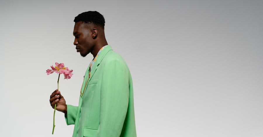 a man holding a flower